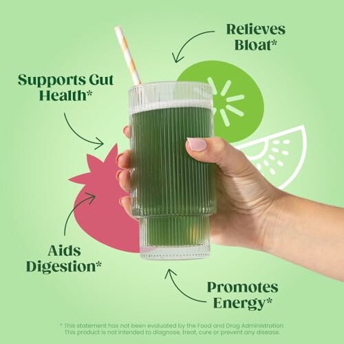 Hand holding a green drink with health benefit labels